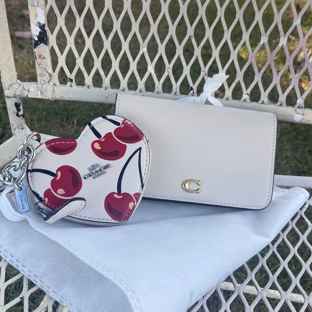 Coach essential slim card case used once.  and cherry coin and charm is NWOT